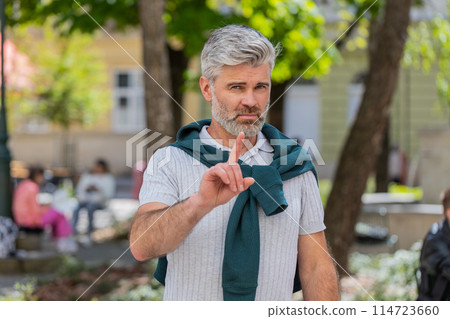 Man reacting to unpleasant awful idea dissatisfied with bad quality wave hand finger, shake head No 114723660