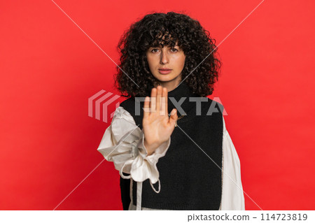 Woman says no hold palm folded crossed hands in stop gesture warning of finish prohibited access 114723819