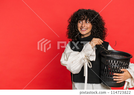 Woman taking off, throwing out glasses into bin after medical vision laser treatment therapy surgery Woman taking off, throwing out glasses into bin after medical vision laser treatment therapy surgery 114723822
