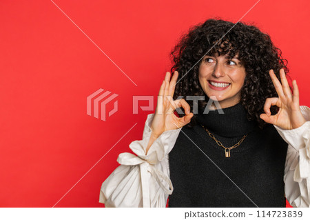 Happy young woman showing ok gesture, like sign positive feedback, celebrate victory, approve idea 114723839