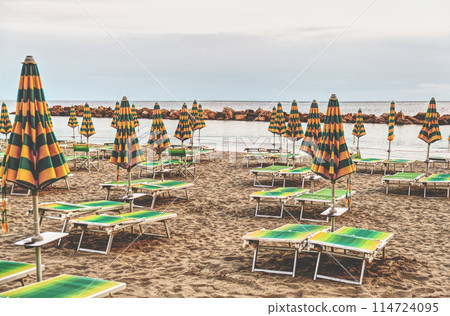 Italy, a deserted bathing establishment on the Ligurian coast. 114724095