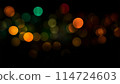 Bokeh lights green orange on black background. Abstract Lights. Unfocused Light background. Blurred night light. bokeh background, Blur concept colorful effect 114724603