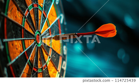 A dart sticks out from the center of the target A dart sticks out from the center of the target 114725439