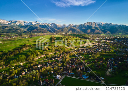 Aerial view of Tatra mountains and Zakopane town at sunset 114725523