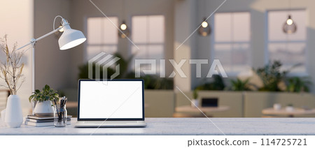 A white-screen laptop computer mockup on a table in a contemporary coffee shop or restaurant. A white-screen laptop computer mockup on a table in a contemporary coffee shop or restaurant. 114725721