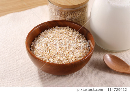 Oatmeal served in a wooden bowl Oatmeal served in a wooden bowl 114729412