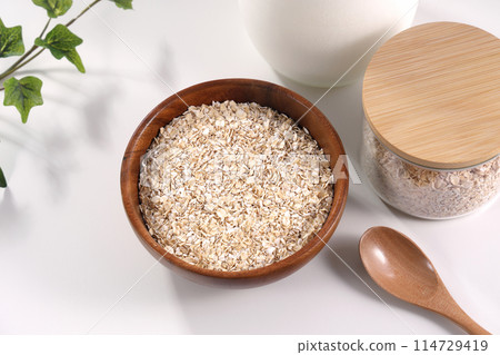 Oatmeal served in a wooden bowl Oatmeal served in a wooden bowl 114729419