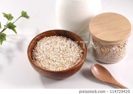 Oatmeal served in a wooden bowl 114729420