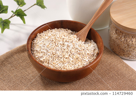 Oatmeal served in a wooden bowl 114729460
