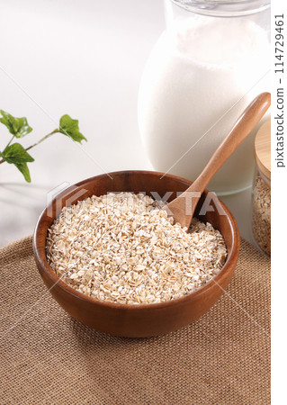 Oatmeal served in a wooden bowl Oatmeal served in a wooden bowl 114729461