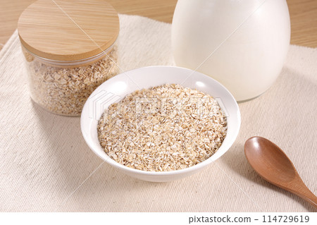 Oatmeal served on a white plate 114729619