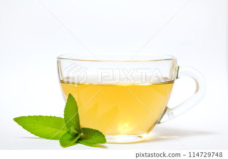 Glass transparent cup with tea and green mint leaf 114729748