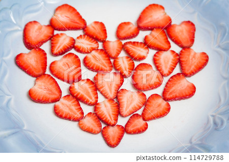 Beautiful heart symbol from chopped red juicy strawberry 114729788