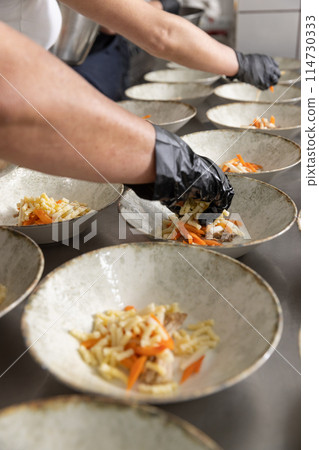 Professional chef plating food Professional chef plating food 114730333