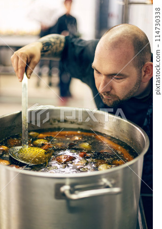 Chef tasting soup Chef tasting soup 114730338