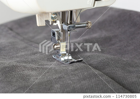 Sewing machine, stitching fabrics, needle in a round plan 114730805