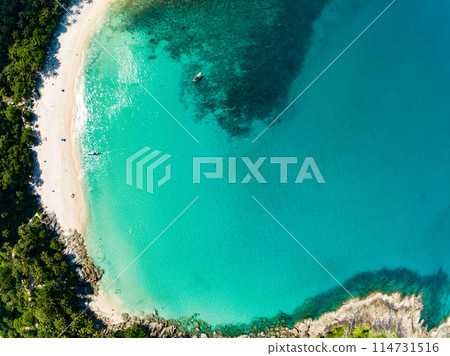 Amazing top view beach Aerial view of Tropical beach sea in the beautiful Phuket island Located at Freedom beach Phuket Thailand Amazing top view beach Aerial view of Tropical beach sea in the beautiful Phuket island Located at Freedom beach Phuket Thailand 114731516