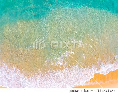 Amazing Top view sea beach landscape background,Summer sea waves crashing on sandy shore seascape background,High angle view ocean nature background 114731528