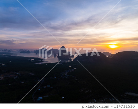 Aerial view sunset sky,Nature beautiful Light Sunset or sunrise over sea,Colorful dramatic majestic scenery sunset Sky with Amazing clouds and waves in sunset sky nature light cloud background 114731530