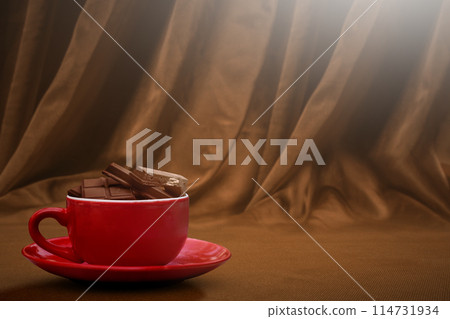 Chocolate pieces on chocolate drink in the cup Chocolate pieces on chocolate drink in the cup 114731934