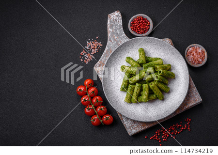 Delicious pasta with spinach sauce, olive oil and parmesan cheese 114734219