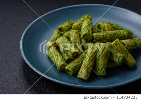Delicious pasta with spinach sauce, olive oil and parmesan cheese 114734225