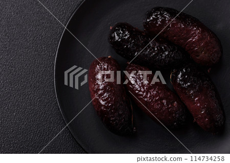 Delicious black blood sausage or black pudding with spices and herbs Delicious black blood sausage or black pudding with spices and herbs 114734258