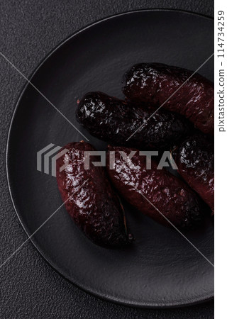 Delicious black blood sausage or black pudding with spices and herbs Delicious black blood sausage or black pudding with spices and herbs 114734259