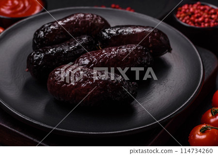 Delicious black blood sausage or black pudding with spices and herbs Delicious black blood sausage or black pudding with spices and herbs 114734260