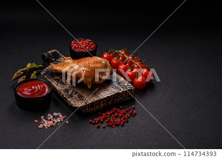 Delicious juicy chicken thighs baked on the grill with salt 114734393