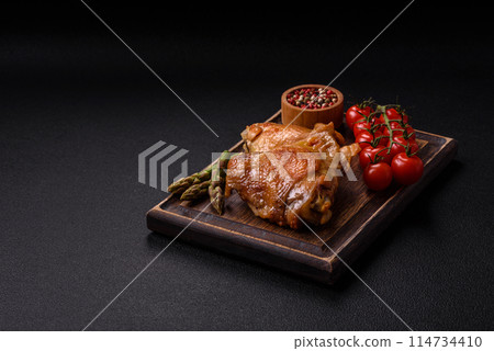 Delicious juicy chicken thighs baked on the grill with salt Delicious juicy chicken thighs baked on the grill with salt 114734410