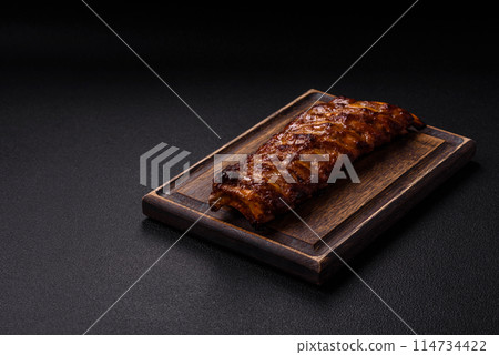 Delicious juicy grilled ribs with honey and mustard sauce 114734422