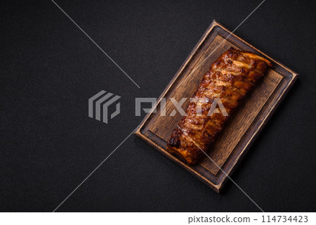 Delicious juicy grilled ribs with honey and mustard sauce 114734423