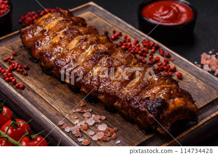 Delicious juicy grilled ribs with honey and mustard sauce 114734428