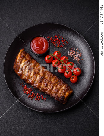 Delicious juicy grilled ribs with honey and mustard sauce Delicious juicy grilled ribs with honey and mustard sauce 114734442