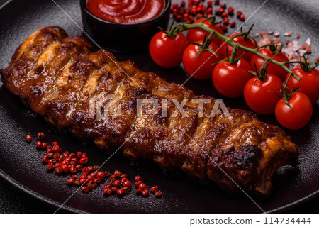 Delicious juicy grilled ribs with honey and mustard sauce Delicious juicy grilled ribs with honey and mustard sauce 114734444