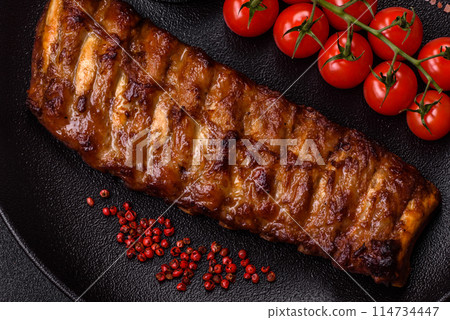 Delicious juicy grilled ribs with honey and mustard sauce Delicious juicy grilled ribs with honey and mustard sauce 114734447