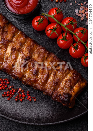 Delicious juicy grilled ribs with honey and mustard sauce Delicious juicy grilled ribs with honey and mustard sauce 114734450