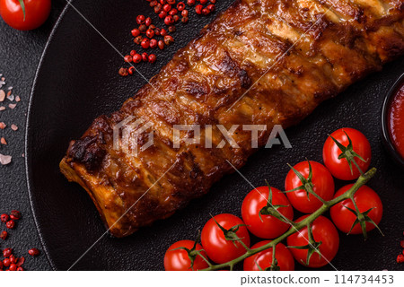 Delicious juicy grilled ribs with honey and mustard sauce Delicious juicy grilled ribs with honey and mustard sauce 114734453
