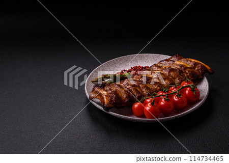 Delicious juicy grilled ribs with honey and mustard sauce Delicious juicy grilled ribs with honey and mustard sauce 114734465
