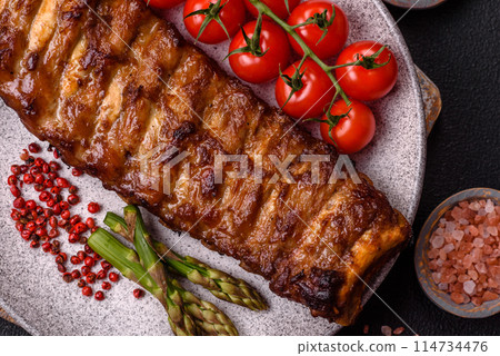 Delicious juicy grilled ribs with honey and mustard sauce Delicious juicy grilled ribs with honey and mustard sauce 114734476