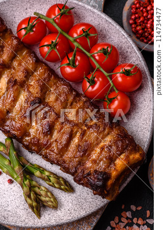 Delicious juicy grilled ribs with honey and mustard sauce 114734477