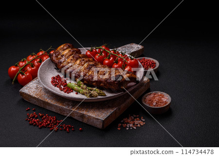 Delicious juicy grilled ribs with honey and mustard sauce Delicious juicy grilled ribs with honey and mustard sauce 114734478