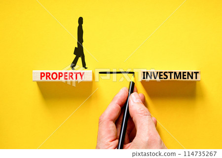 Property investment symbol. Concept words Property investment on beautiful wooden block. Businessman hand. Beautiful yellow paper background. Business Property investment concept. Copy space. Property investment symbol. Concept words Property investment on beautiful wooden block. Businessman hand. Beautiful yellow paper background. Business Property investment concept. Copy space. 114735267