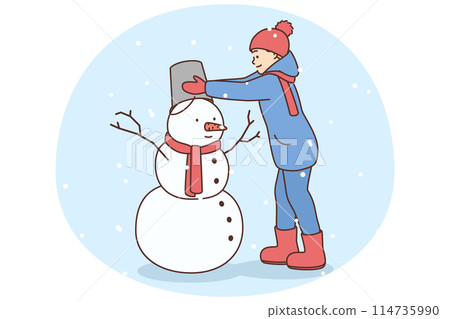 Happy kid build snowman outdoors Happy kid build snowman outdoors 114735990