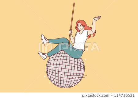 Woman swings on large disco ball and waves hand welcomingly, inviting guests to student party 114736521