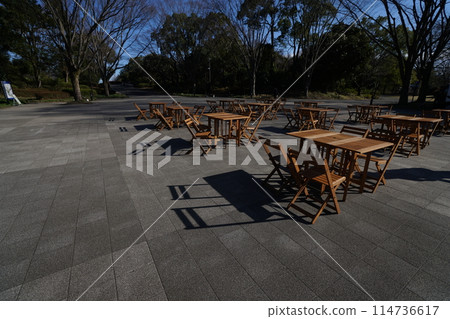 Tables and chairs in the park Tables and chairs in the park 114736617