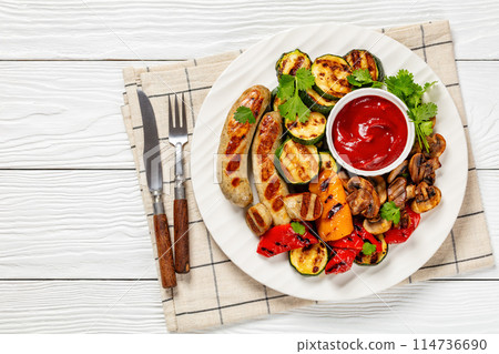 grilled white sausages with veggies and mushrooms 114736690