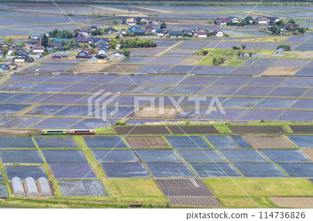 Aizu Basin scenery in early summer and a train on the Tadami Line, aerial view from Futanuma, Aizu Misato Town, Fukushima Prefecture Aizu Basin scenery in early summer and a train on the Tadami Line, aerial view from Futanuma, Aizu Misato Town, Fukushima Prefecture 114736826