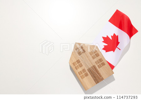 A wooden house with the flag of Canada 114737293